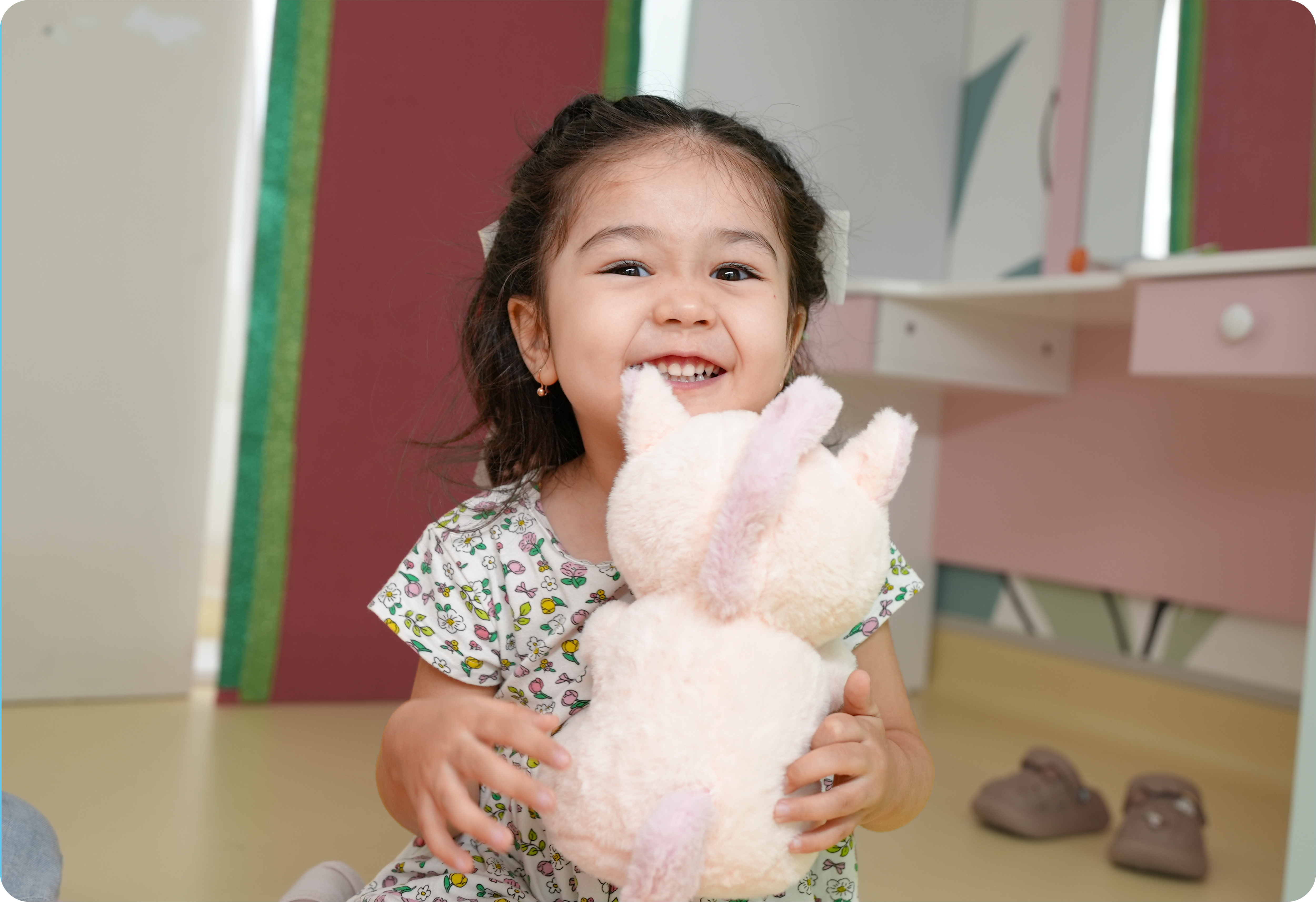 Child with plush toy